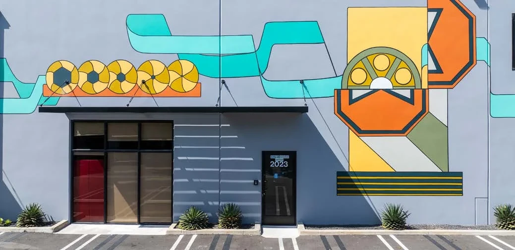 Film-reel mural and entrance at Westgate Media Park