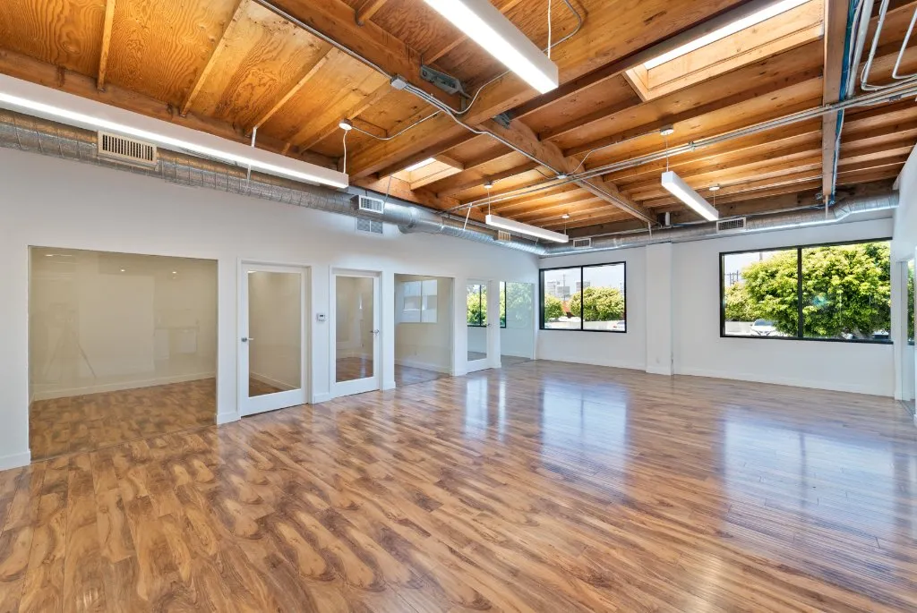 Westgate interior with exposed ceilings and open work area